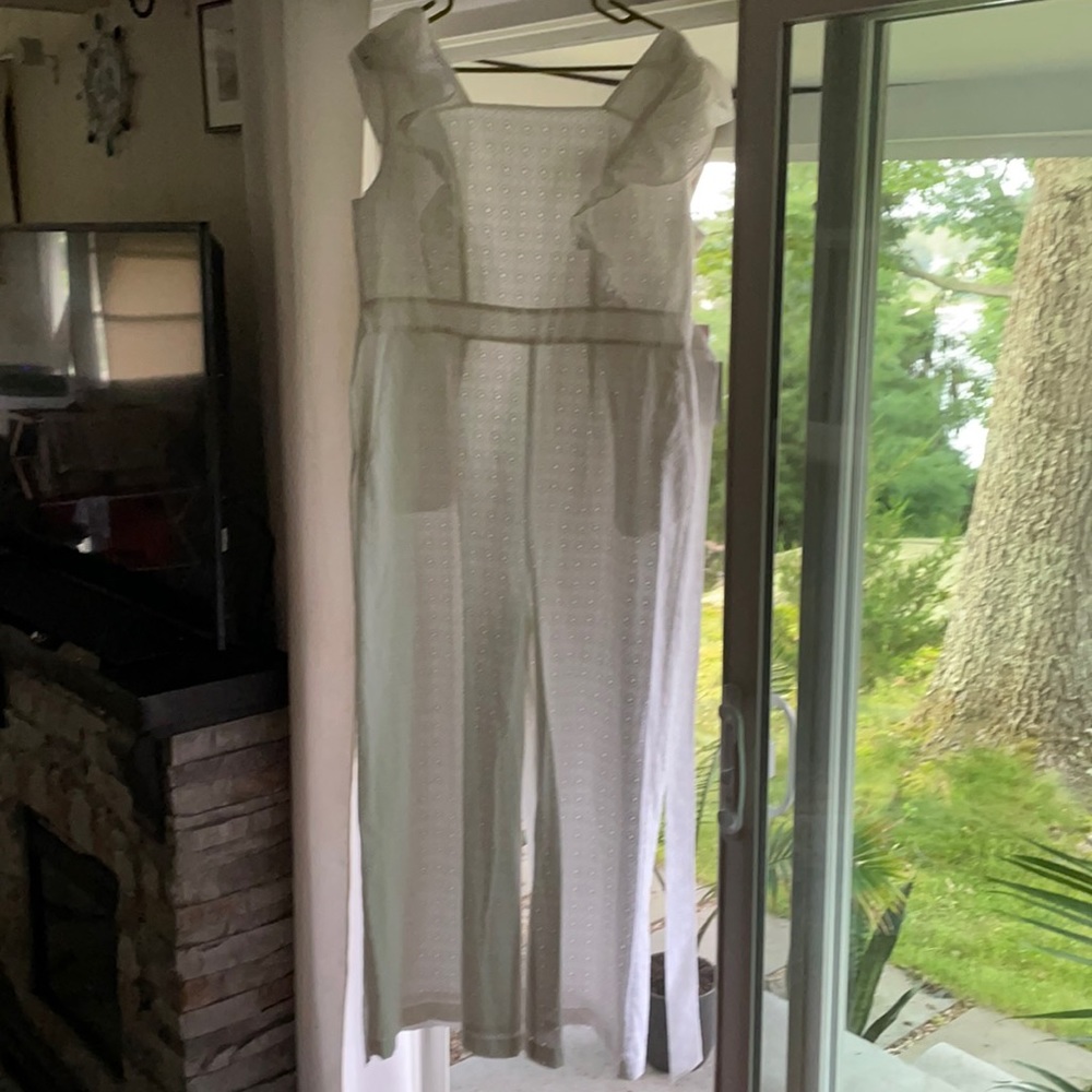 Tags on never worn white eyelet romper size L